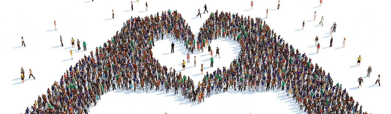 Many people forming the heart symbol of two hands